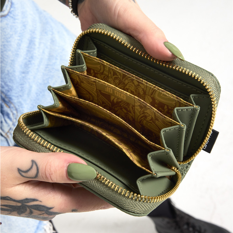 Woman's hands holding open the Loungefly COLLECTIV Marvel Loki the ORGANIZR Accordion Wallet to show the slots inside to organize cards and cash.